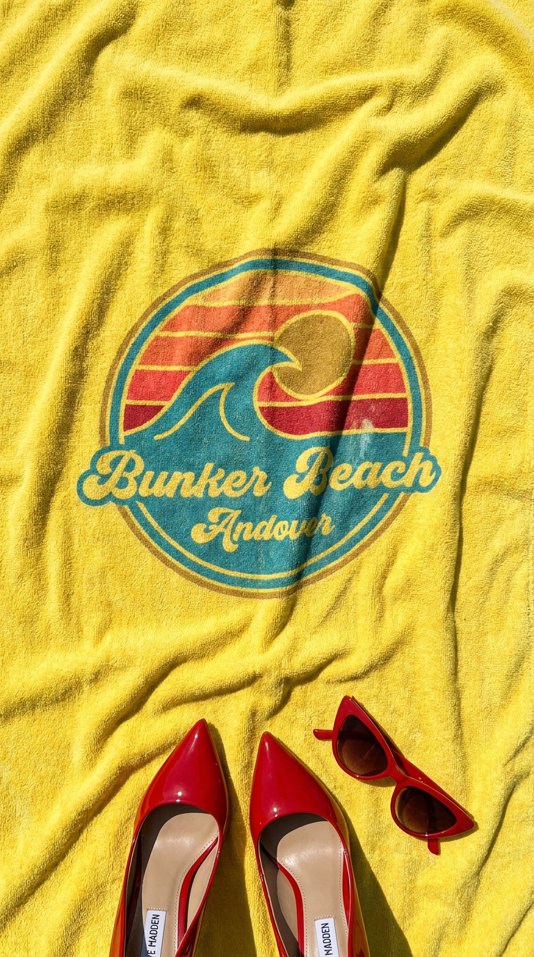 Andover — red heels flat lay on Bunker Beach yellow beach towel